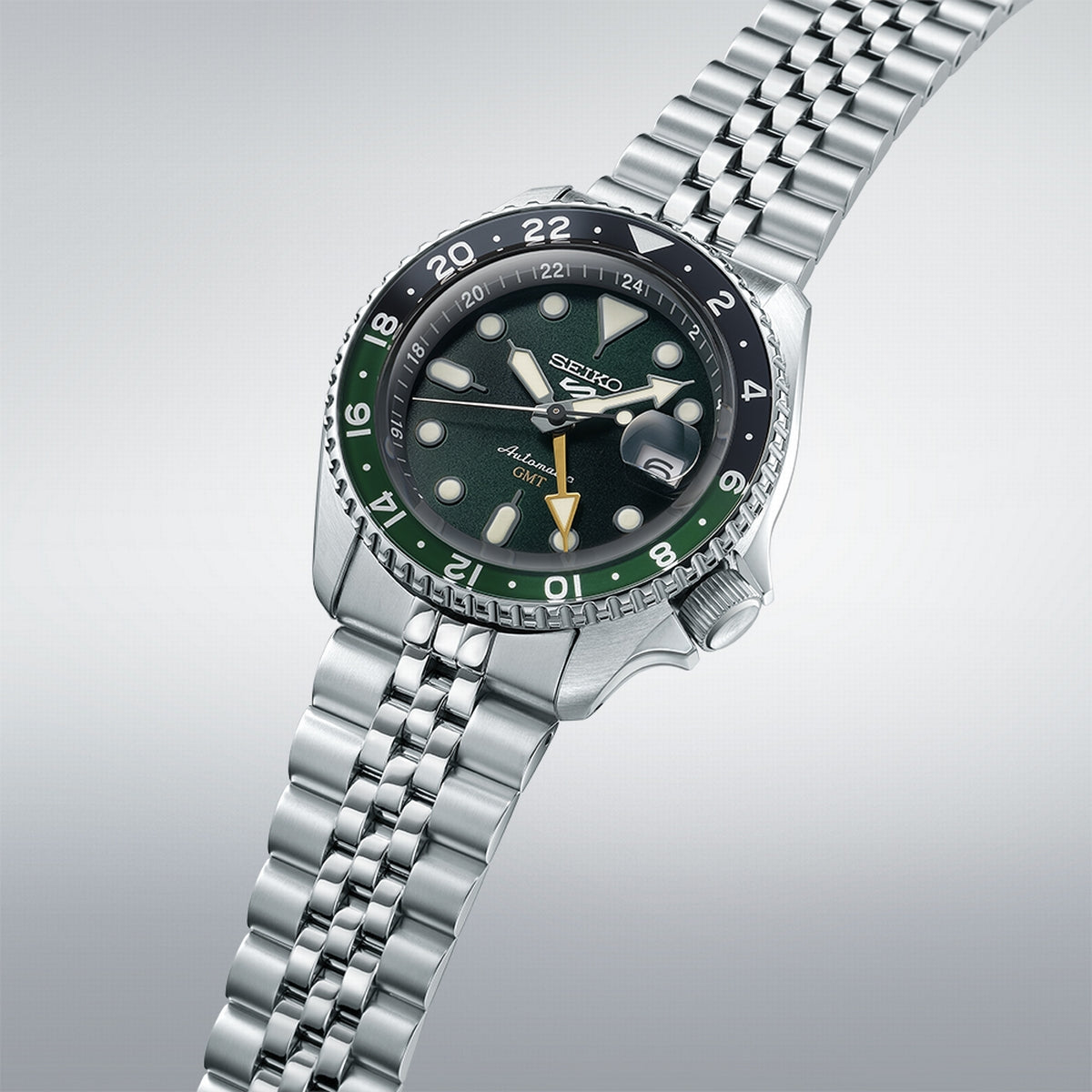 seiko 5 sports skx gmt black & green bezel with a green dial