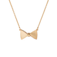 tessla: crystal tux bow gold pendant