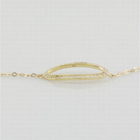 9k yellow gold bracelet with open oblong in white cz