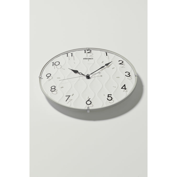 seiko quartz black wall clock with white wavy dial